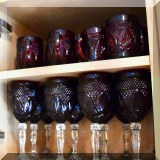 G11. Set of Cristal d'Arques ruby glass dinnerware, including bowls, plates, goblets and mugs. 